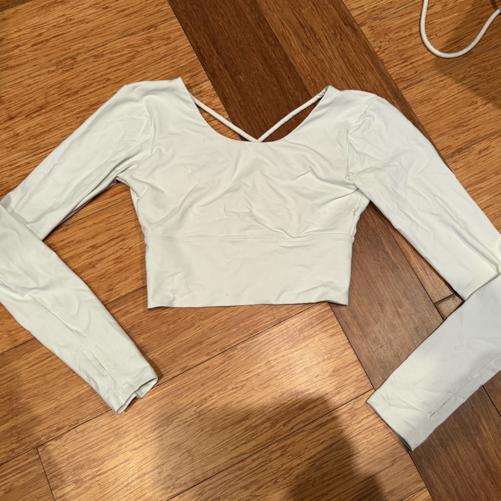 Strappy back white long sleeve workout top